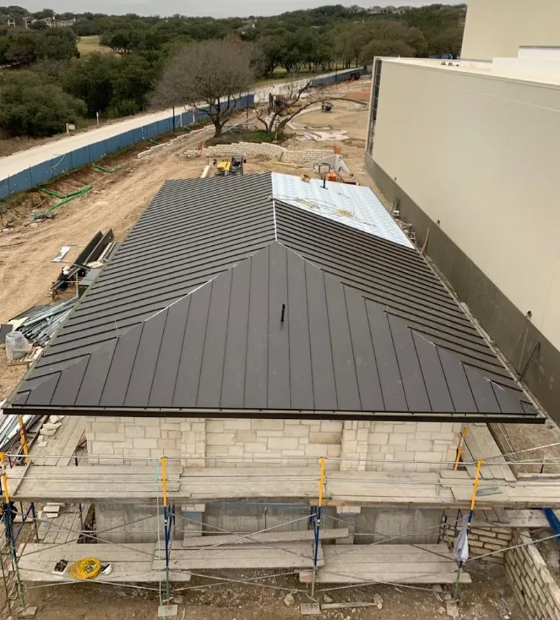 Metal roof new construction with scaffolding in Hybla Valley